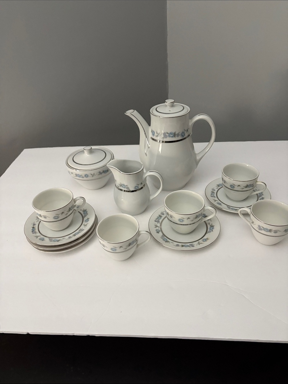 White Porcelain Tea Set with Blue Floral Trim